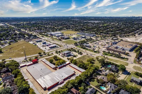 an aerial view of residential building with parking