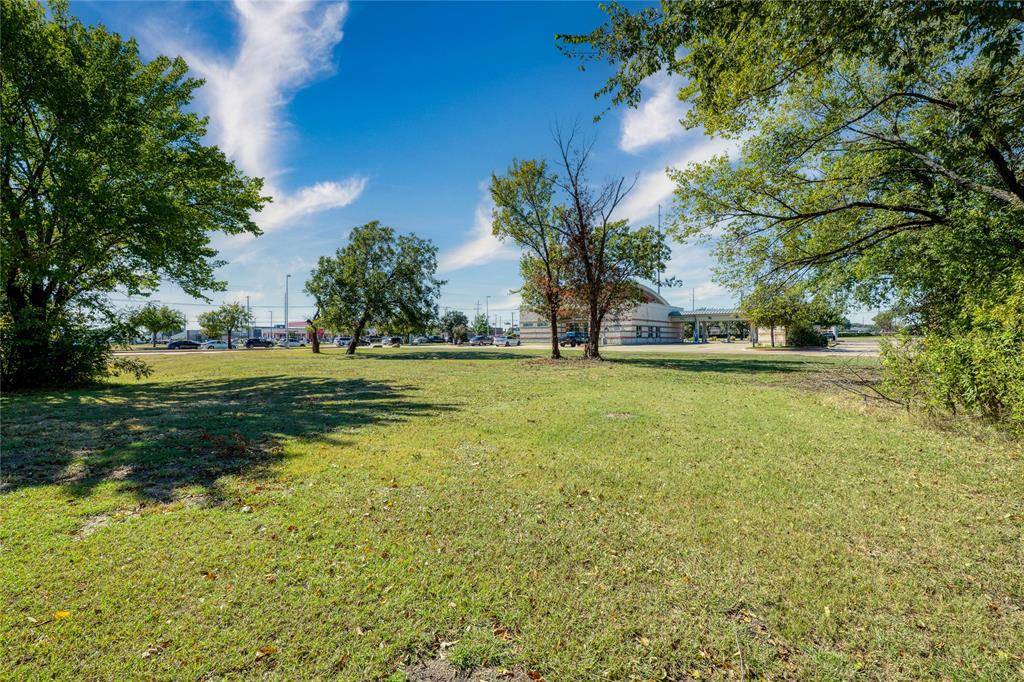 2401 Arapaho Road Garland, TX 75044 - Photo 6 of 15 a view of a field with an trees