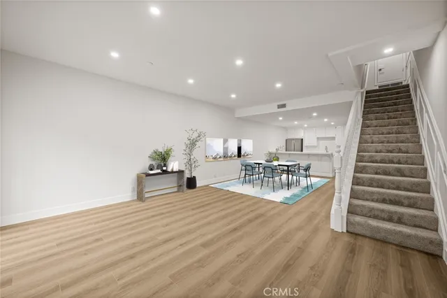 a view of a room with lots of wooden furniture and a view of living room