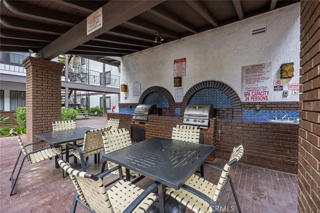 a swimming pool with outdoor seating and yard