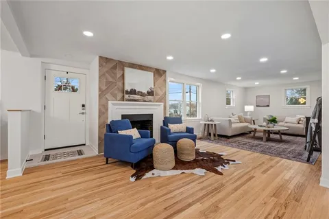 a living room with furniture or fireplace and a wooden floor