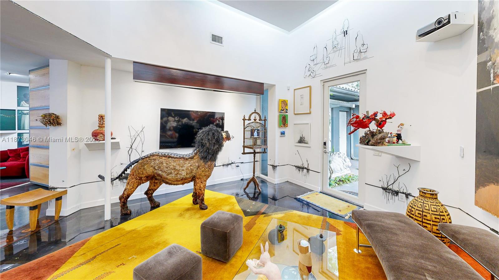 2101 Tigertail Avenue Miami, FL 33133 - Photo 20 of 92 a living room with furniture and a flat screen tv