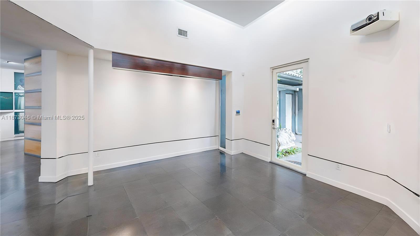 2101 Tigertail Avenue Miami, FL 33133 - Photo 21 of 92 a view of an empty room with wooden floor