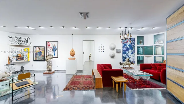 a bathroom with a toilet a sink and view of bathroom