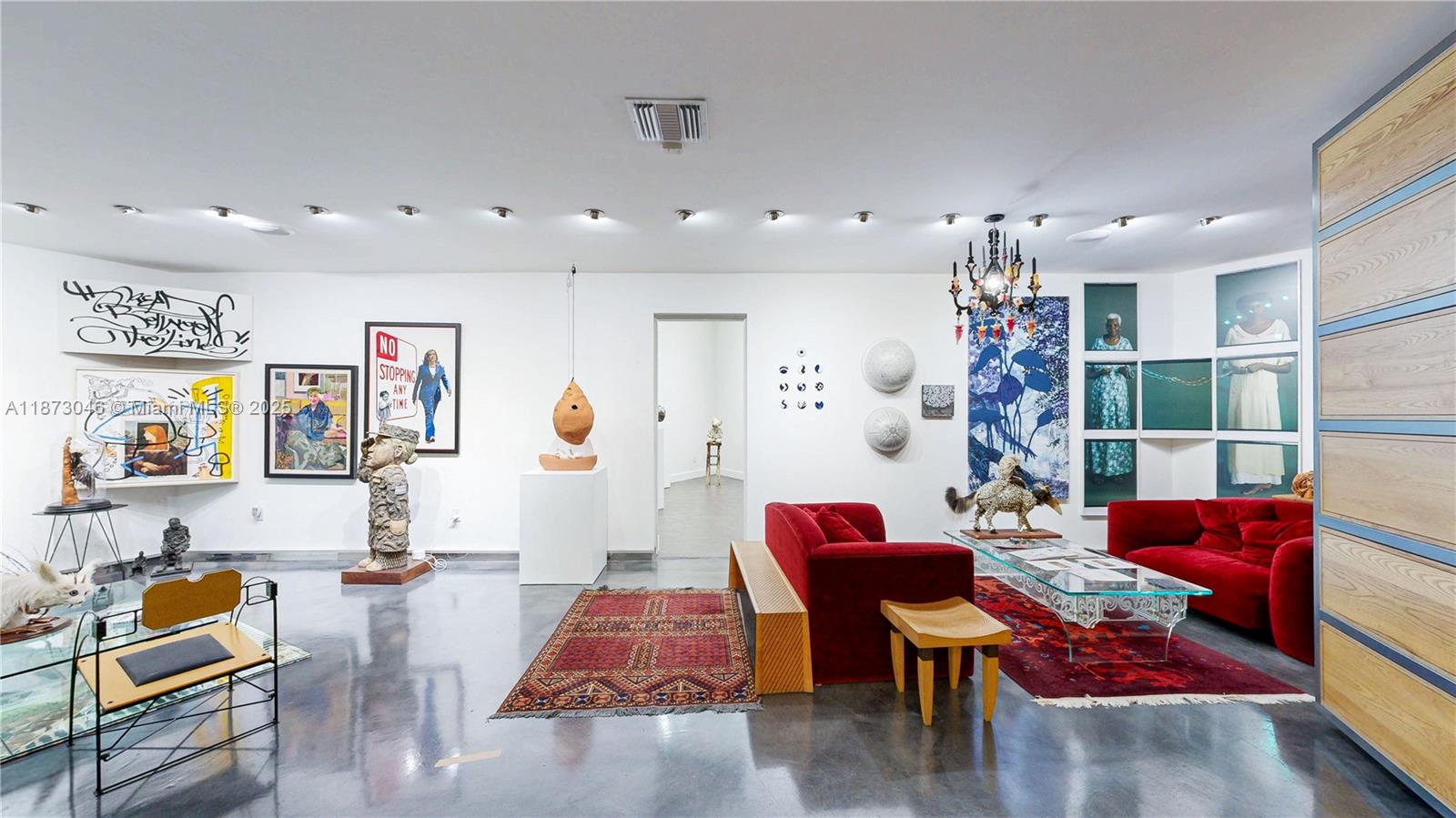 2101 Tigertail Avenue Miami, FL 33133 - Photo 22 of 92 a living room with furniture and wooden floor