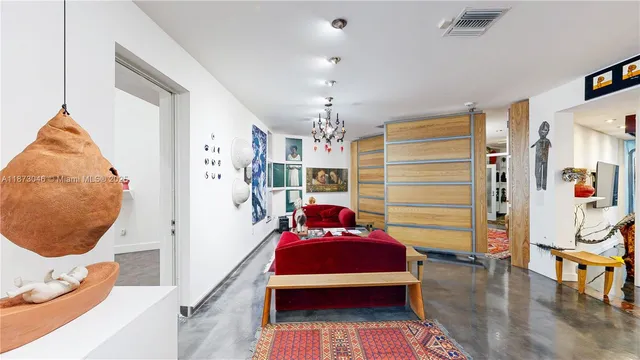 an empty room with a empty space and windows