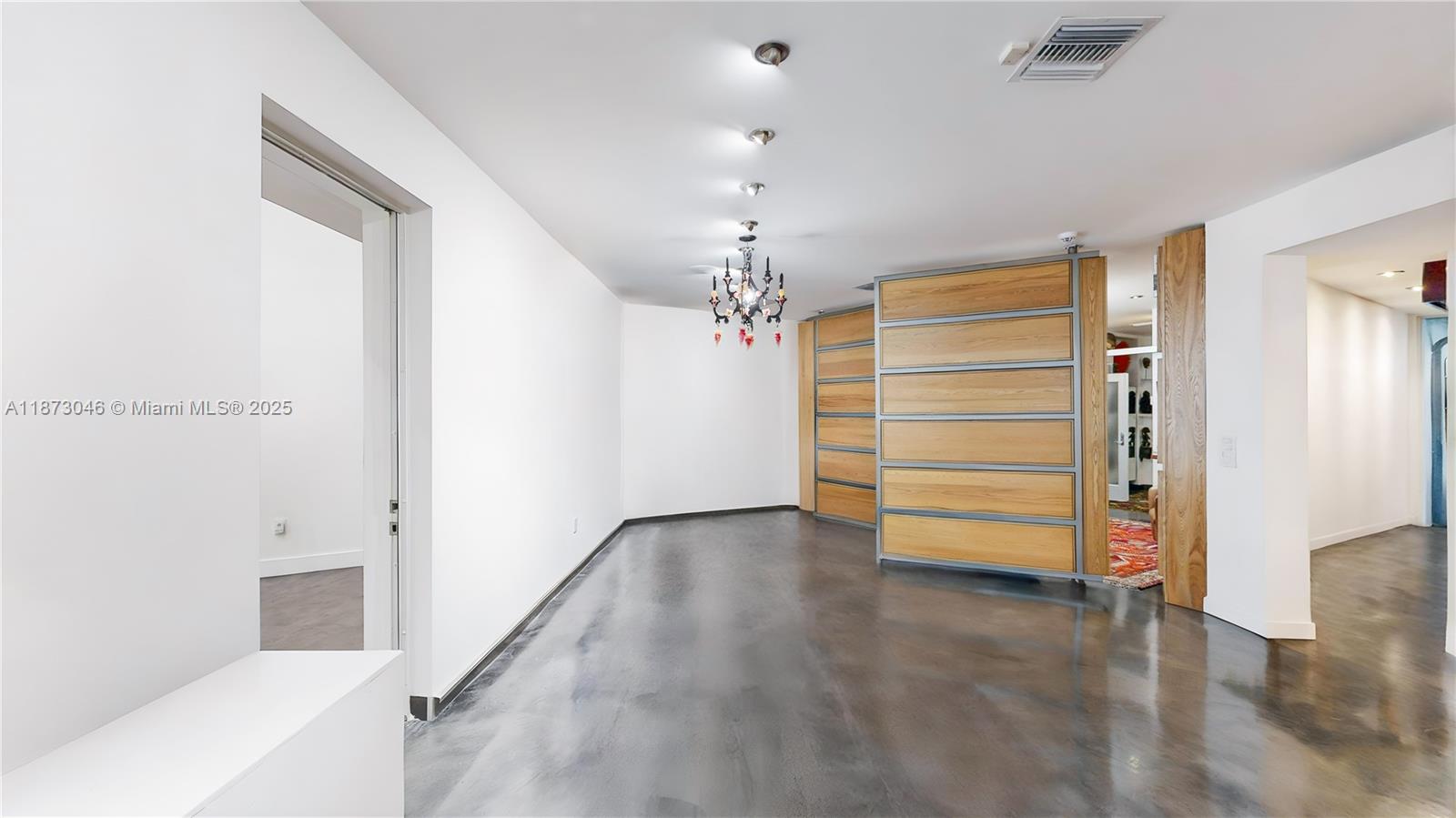 2101 Tigertail Avenue Miami, FL 33133 - Photo 25 of 92 a view of room with stairs and a ceiling fan
