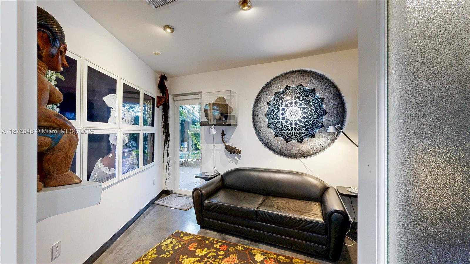 2101 Tigertail Avenue Miami, FL 33133 - Photo 30 of 92 a living room with furniture and a large window