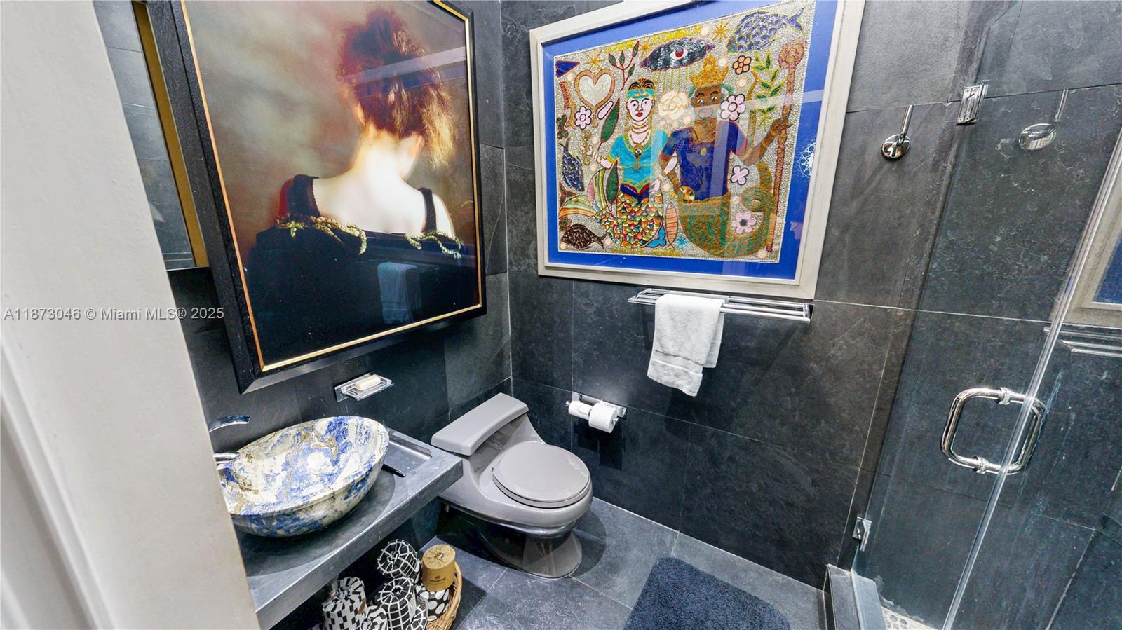 2101 Tigertail Avenue Miami, FL 33133 - Photo 33 of 92 a bathroom with a toilet a sink and view of bathroom