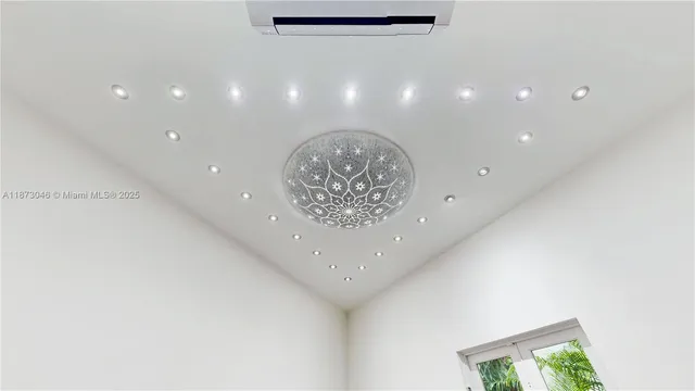 a view of empty room with furniture and staircase