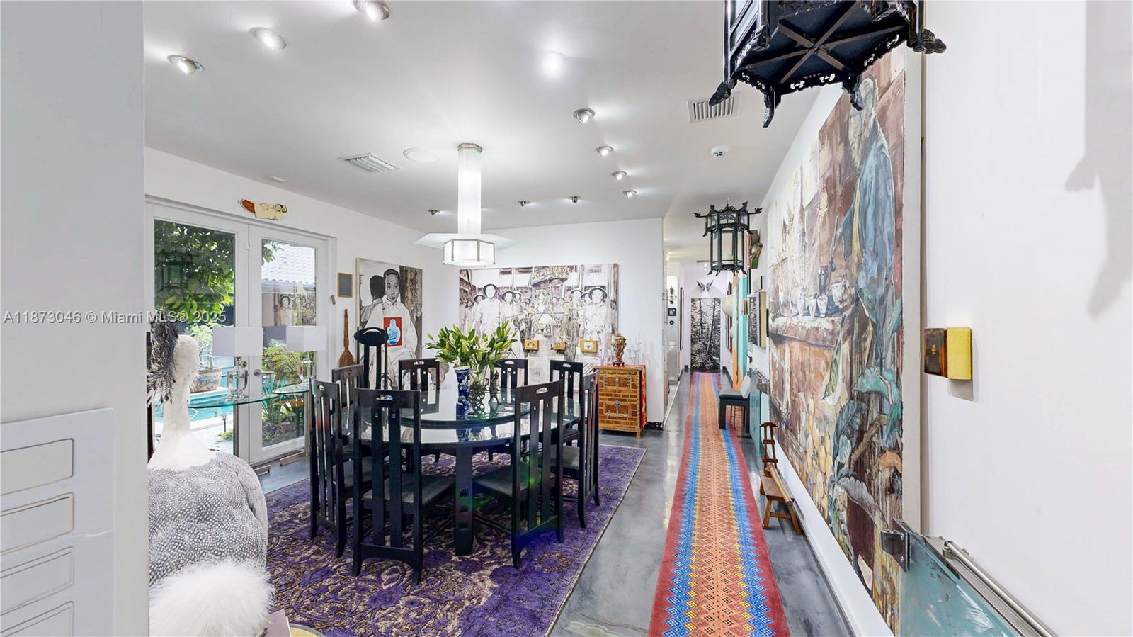 2101 Tigertail Avenue Miami, FL 33133 - Photo 44 of 92 a view of a dining room with furniture window and wooden floor
