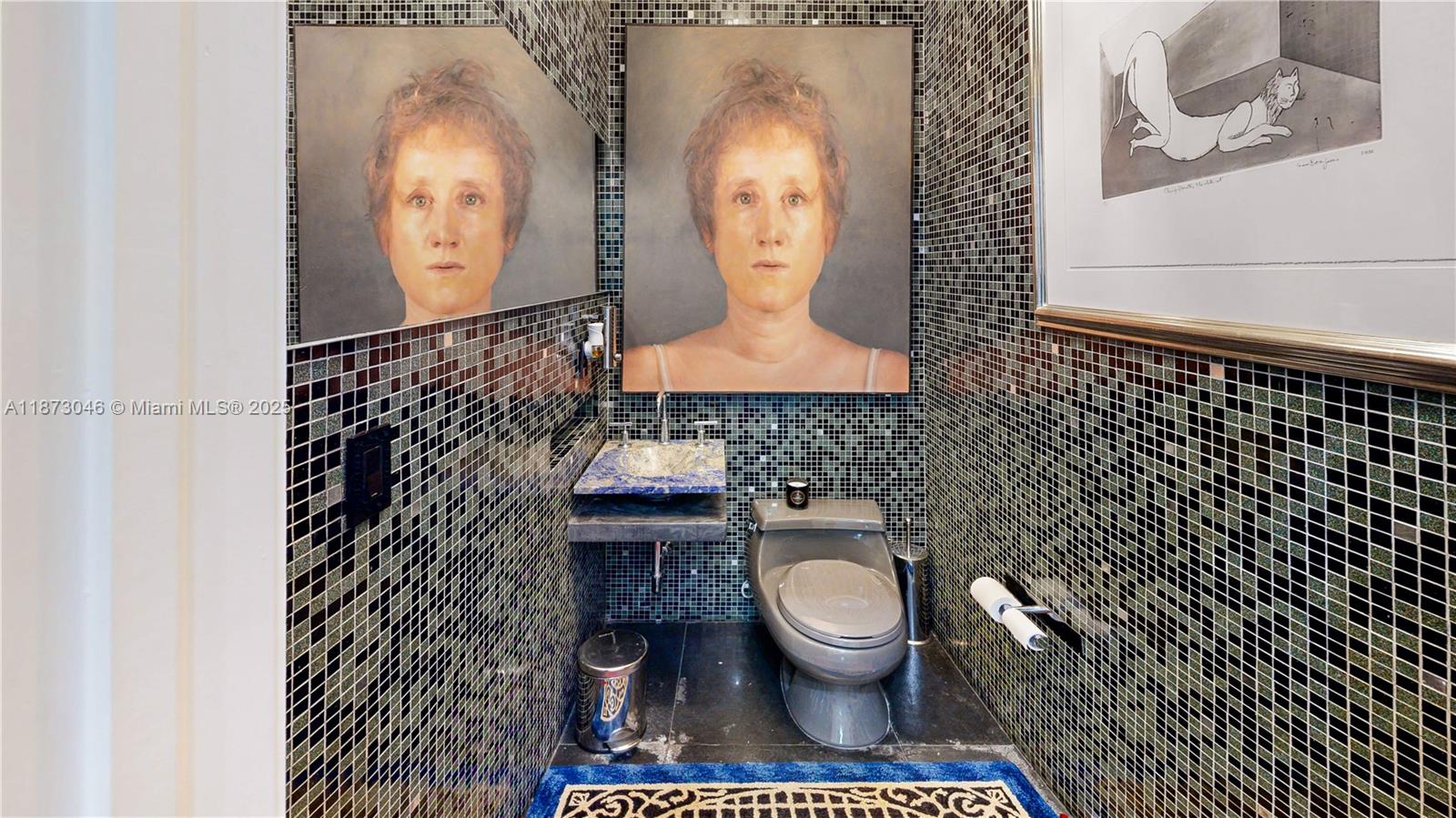 2101 Tigertail Avenue Miami, FL 33133 - Photo 51 of 92 a bathroom with a toilet and a sink