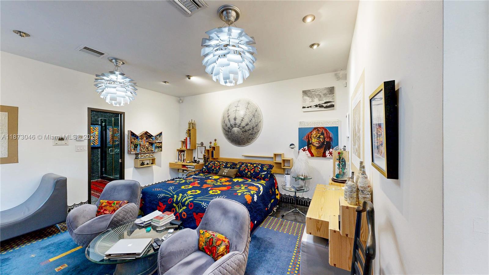 2101 Tigertail Avenue Miami, FL 33133 - Photo 55 of 92 a bed room with furniture and a chandelier