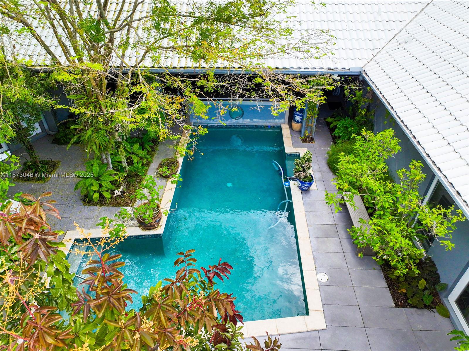 2101 Tigertail Avenue Miami, FL 33133 - Photo 72 of 92 a view of a garden with flowers