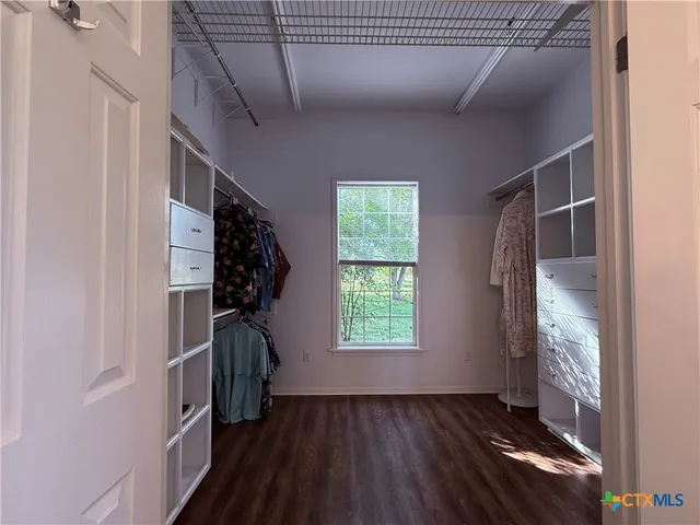 a view of entryway with wooden floor and stairs