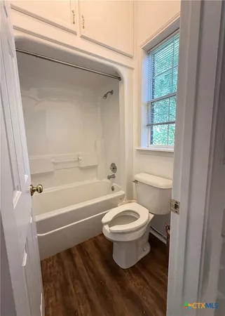 a bathroom with a sink toilet and bathtub