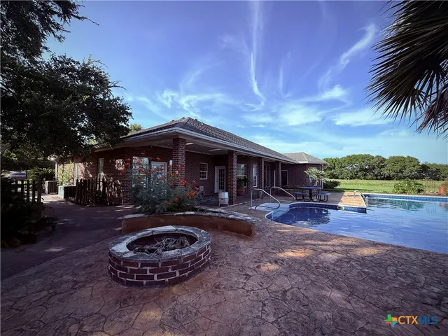 a front view of a house with garden and porch