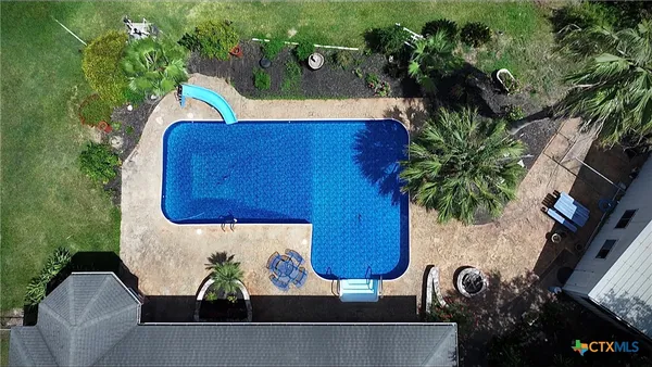 a view of a backyard with potted plants