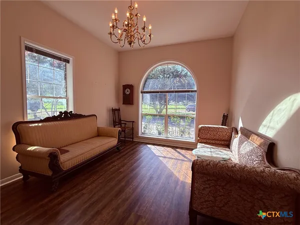 a bedroom with furniture and a window