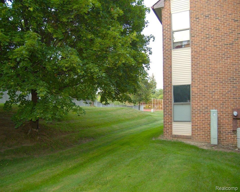 6540 Ridgefield Circle, Unit 101 West Bloomfield, MI 48322 - Photo 4 of 18 End Unit Backyard.JPG