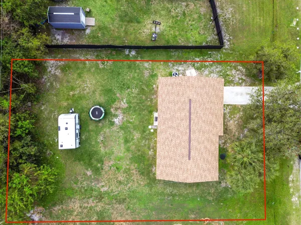 an aerial view of a house with a garden