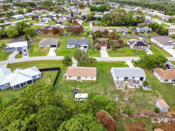 an aerial view of residential building and lake