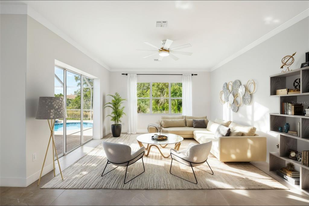 629 Sawgrass Bridge Road Venice, FL 34292 - Photo 13 of 36 a living room with furniture a window and a table