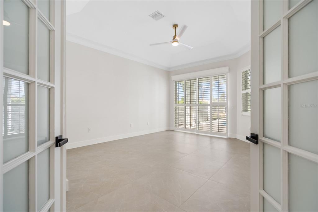 629 Sawgrass Bridge Road Venice, FL 34292 - Photo 14 of 36 a view of an empty room with a window