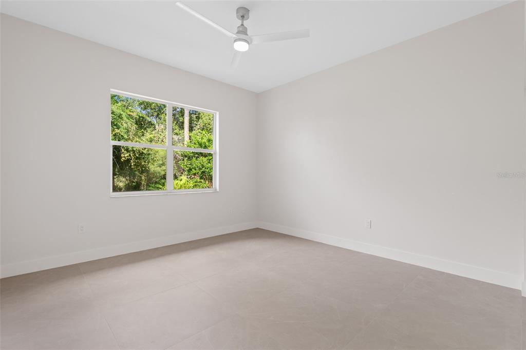 629 Sawgrass Bridge Road Venice, FL 34292 - Photo 22 of 36 an empty room with a window