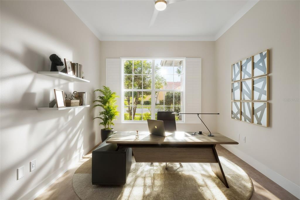 629 Sawgrass Bridge Road Venice, FL 34292 - Photo 28 of 36 a living room with furniture and a large window