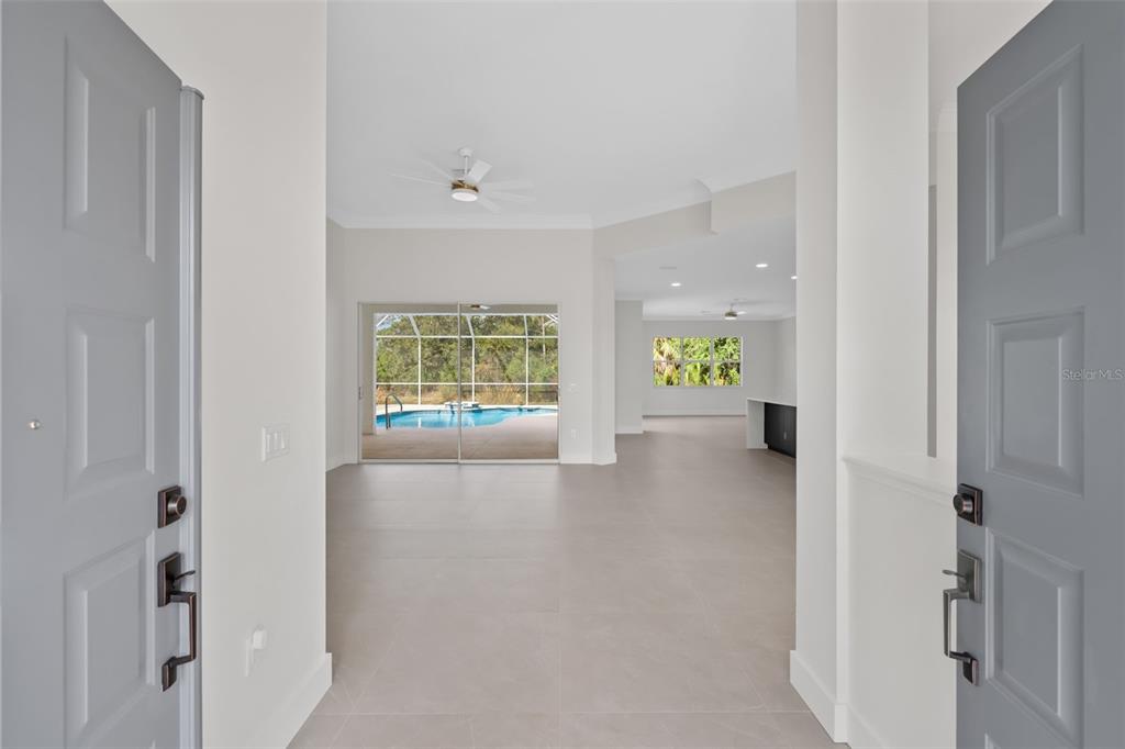 629 Sawgrass Bridge Road Venice, FL 34292 - Photo 4 of 36 a view of an entryway with wooden floor