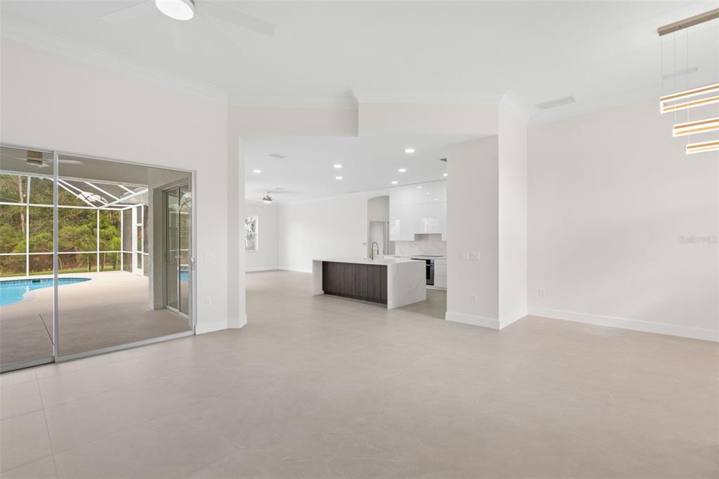 629 Sawgrass Bridge Road Venice, FL 34292 - Photo 5 of 36 a view of an empty room with a kitchen
