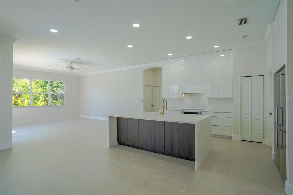 629 Sawgrass Bridge Road Venice, FL 34292 - Photo 7 of 36 a kitchen with sink cabinets and window
