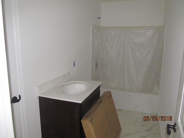 170 Putman Well Road Rockvale, TN 37153 - Photo 5 of 6 a bathroom with a sink and a mirror