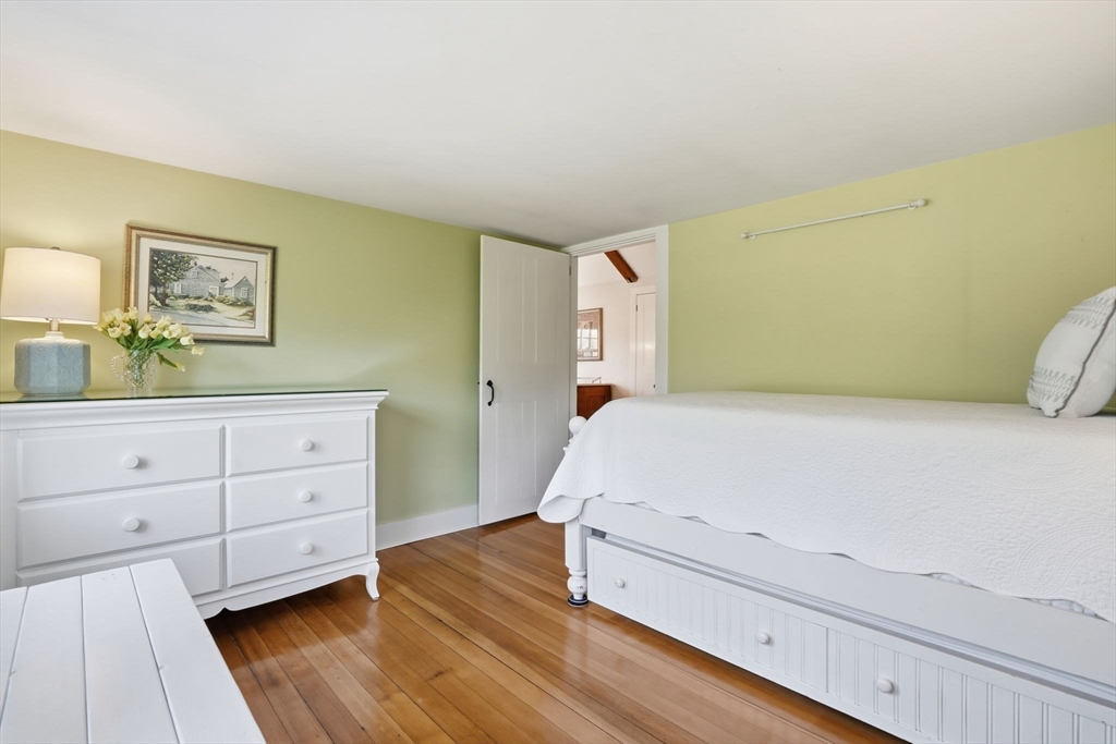 178 Main Street Plympton, MA 02367 - Photo 14 of 37 a bedroom with a bed and a dresser