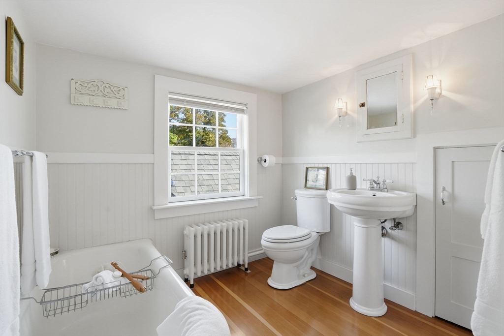 178 Main Street Plympton, MA 02367 - Photo 15 of 37 a bathroom with a sink toilet a window and tub