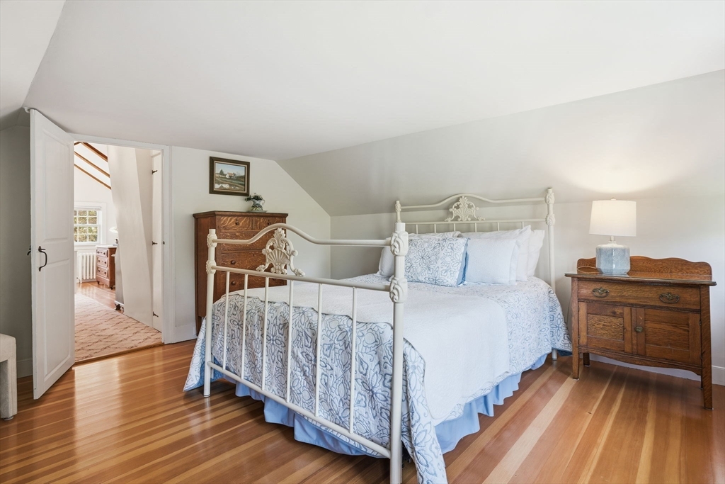 178 Main Street Plympton, MA 02367 - Photo 17 of 37 a bedroom with a bed and wooden floor