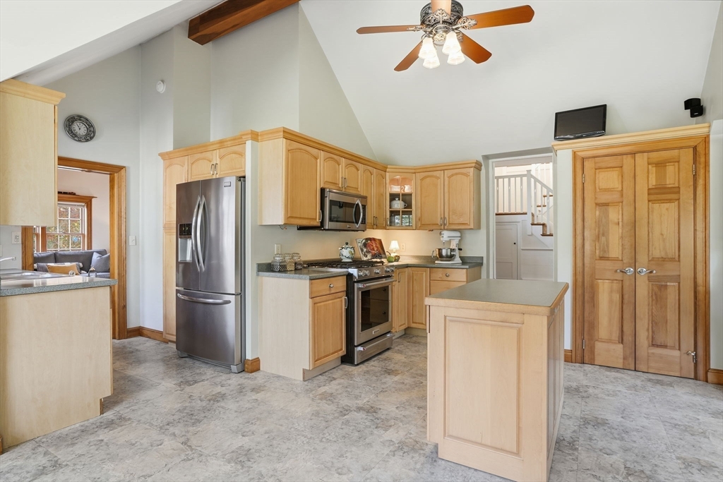 178 Main Street Plympton, MA 02367 - Photo 21 of 37 a kitchen with stainless steel appliances a refrigerator stove microwave and cabinets