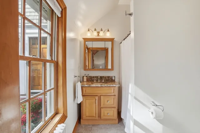 a patio with a table and chairs under an umbrella