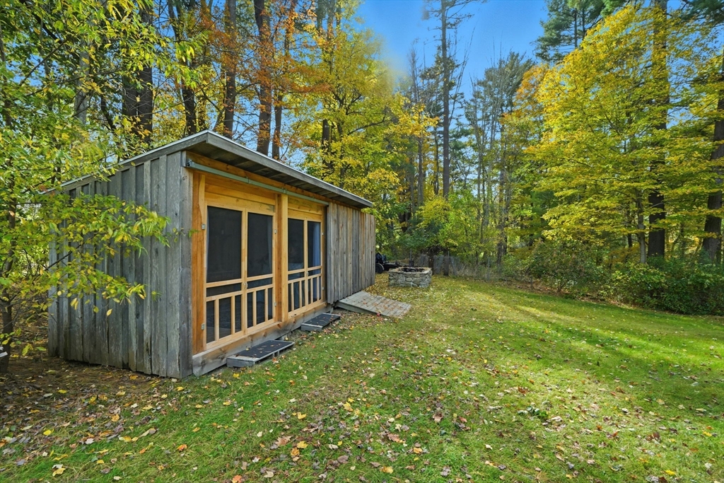 178 Main Street Plympton, MA 02367 - Photo 31 of 37 a backyard of a house with lots of green space and fountain