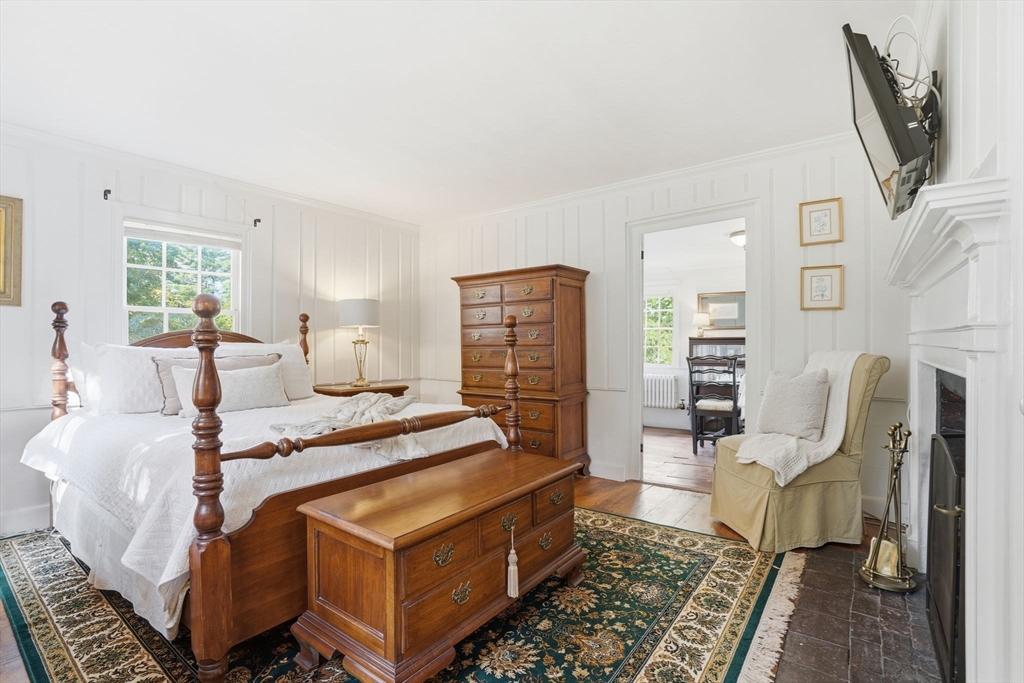 178 Main Street Plympton, MA 02367 - Photo 6 of 37 a living room with furniture a fireplace and a table