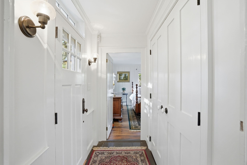 178 Main Street Plympton, MA 02367 - Photo 7 of 37 a view of a hallway with wooden floor and staircase