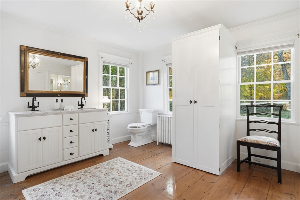 178 Main Street Plympton, MA 02367 - Photo 8 of 37 a bathroom with a double vanity sink a toilet and a window