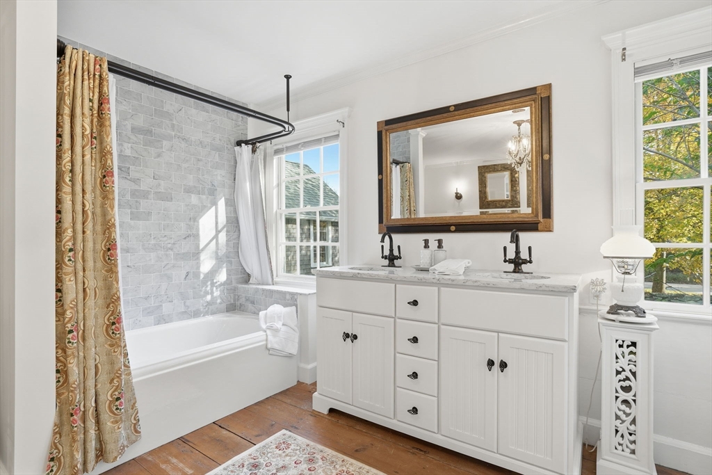 178 Main Street Plympton, MA 02367 - Photo 9 of 37 a bathroom with a double vanity sink bathtub and next to a window