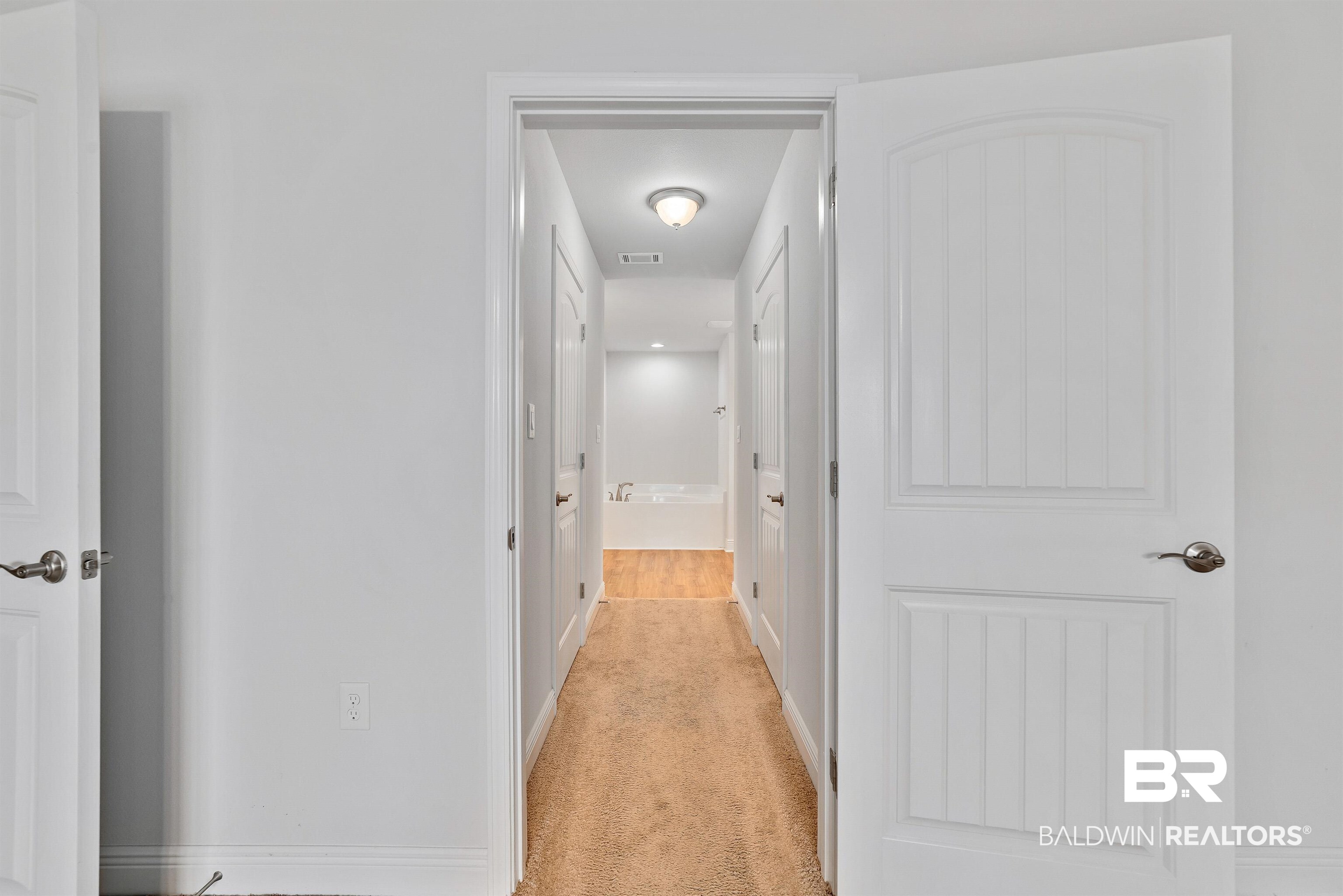 13155 Wishbone Court Foley, AL 36535 - Photo 23 of 39 Corridor with light colored carpet