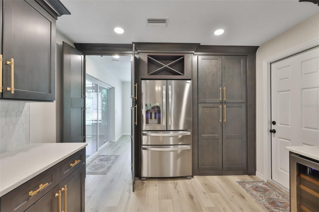 1578 Indian Bay Road Spring Hill, FL 34607 - Photo 20 of 51 a metallic refrigerator freezer sitting inside of a kitchen