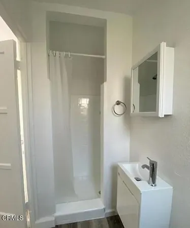 a bathroom with a sink and mirror