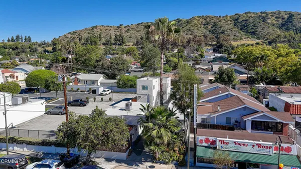a view of multiple houses with a street