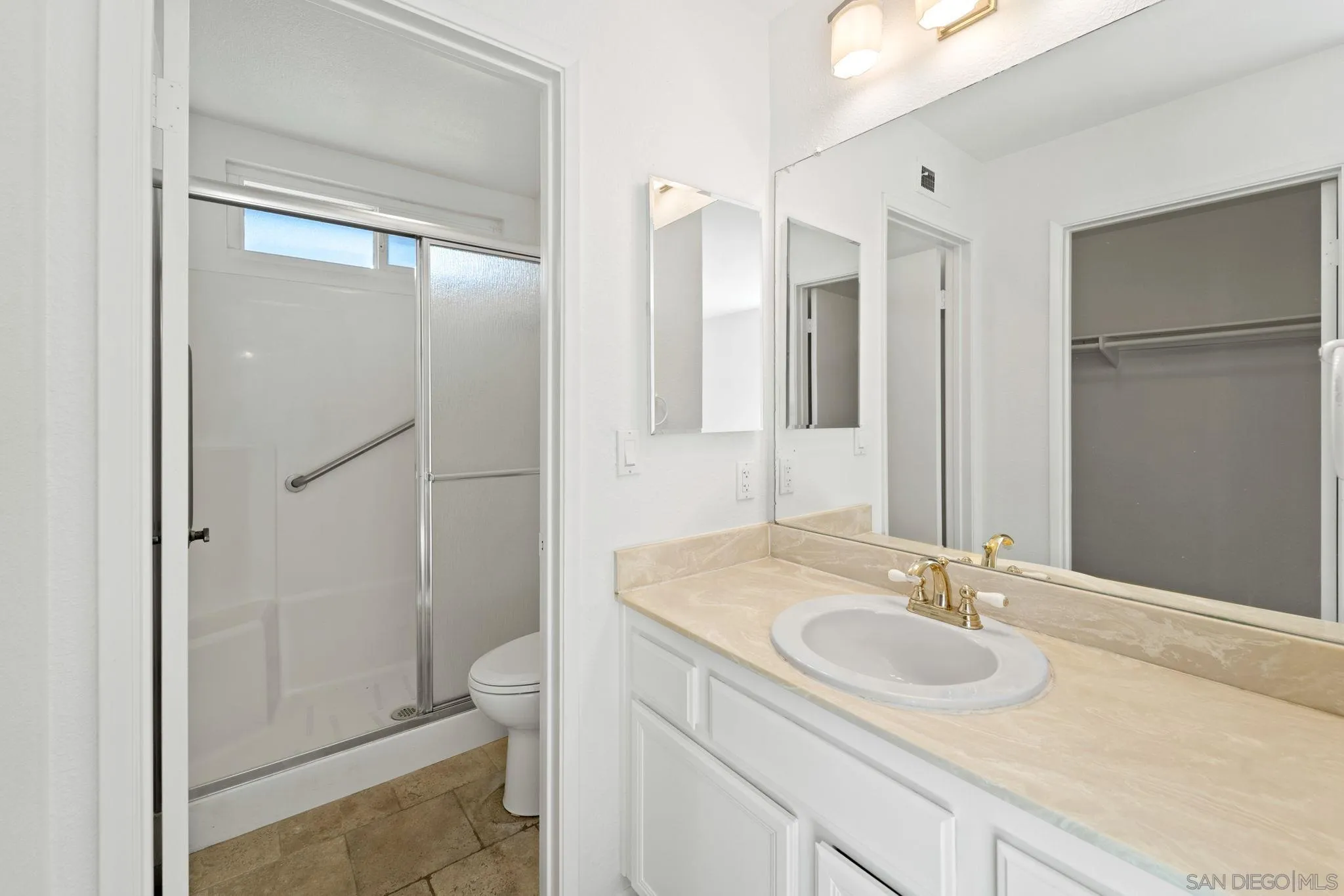 10174 West Glendon Circle Santee, CA 92071 - Photo 15 of 41 a bathroom with a sink toilet and shower