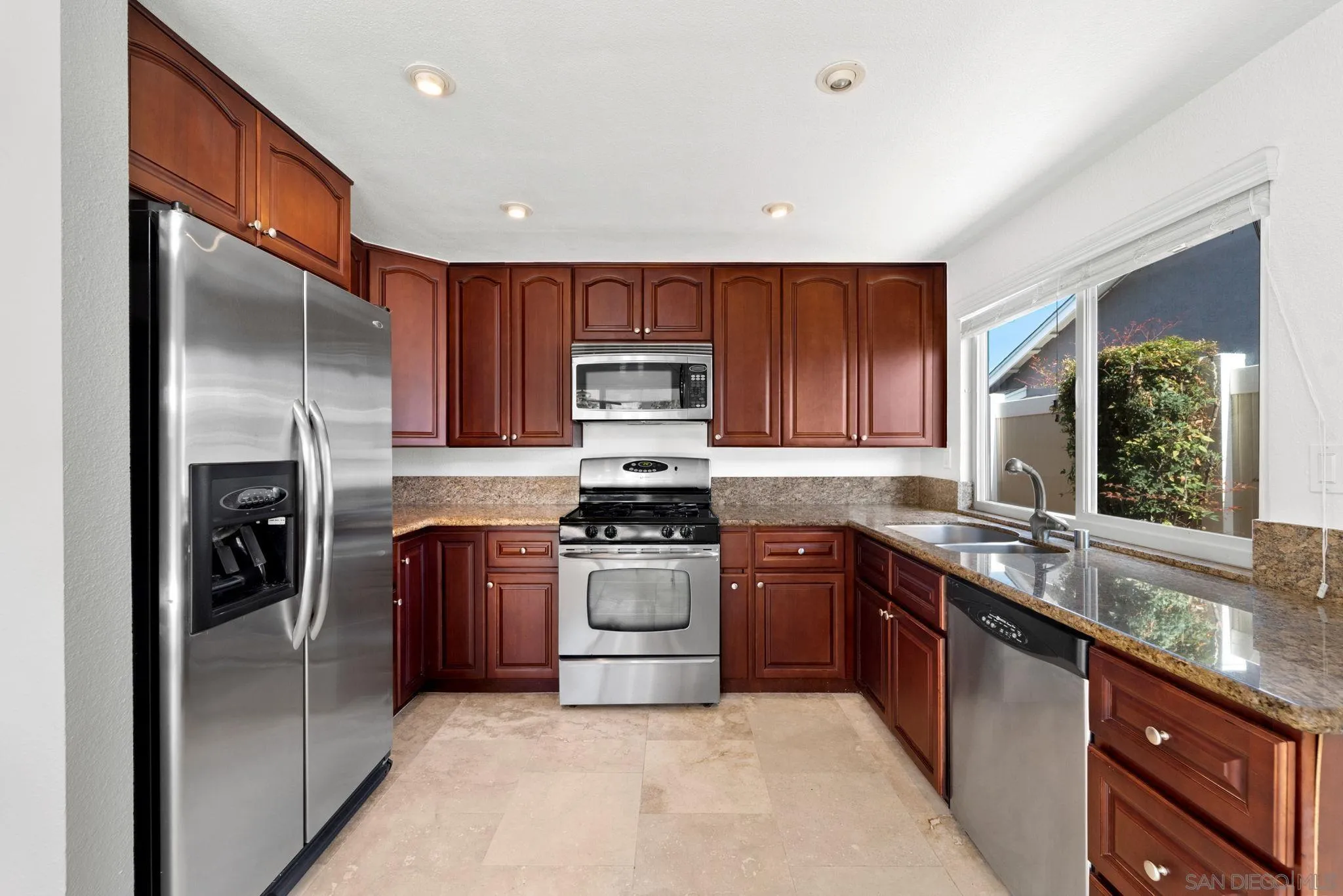 10174 West Glendon Circle Santee, CA 92071 - Photo 2 of 41 a kitchen with stainless steel appliances granite countertop a sink a stove and a refrigerator